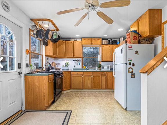 Kitchen view with ceiling fan