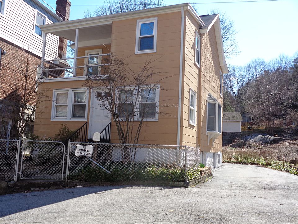 Cozy Colonial sited on 50 X 170 deep flat lot.