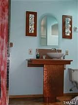 Pedestal sink in master bath; copper column.