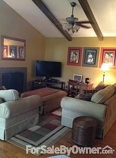 Living room with vaulted ceilings