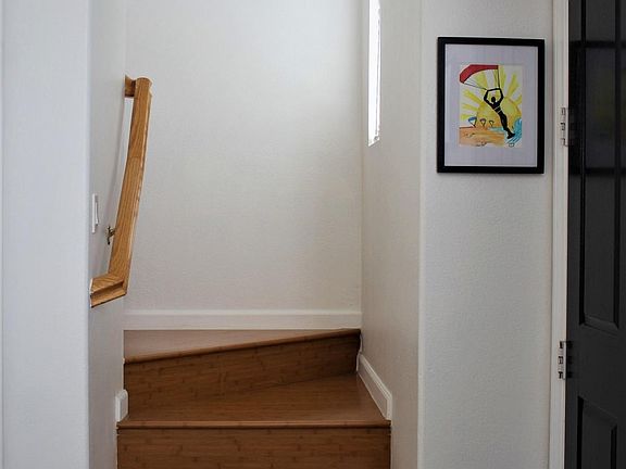 Stairwell leading to upstairs bedrooms, bamboo wood-flooring