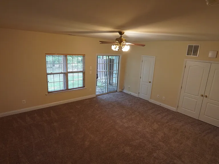 Finished basement, half bath, and utility closet. Access garage through basement. Access to back of home via sliding basement doors.