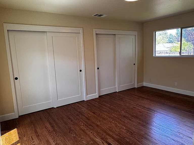 Big bedroom (#3) with double closets and patio door