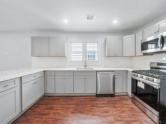 Fully Renovated Kitchen- Cabinets with soft draw closers and quartz countertops. Stainless Steel Appliances with Wifi Smart Technology.