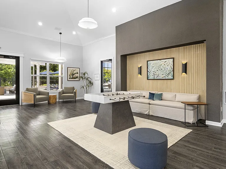 Clubroom game area with foosball and lounge seating for game night with friends