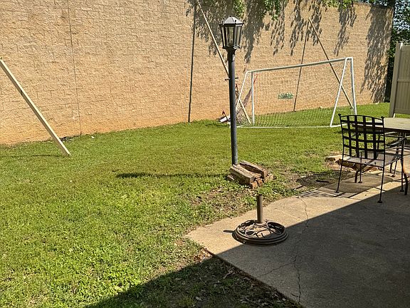 View of fenced backyard.
