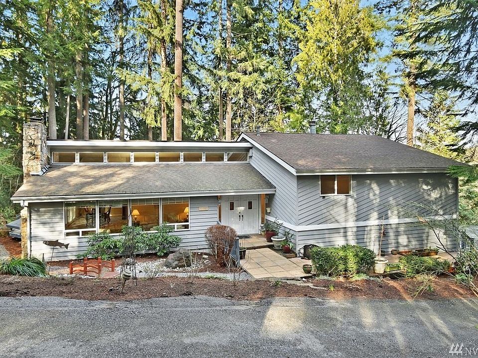 This 4 bedroom home is located in the community of Reintree Estates in Woodinville boasting over an acre of private natural garden space.