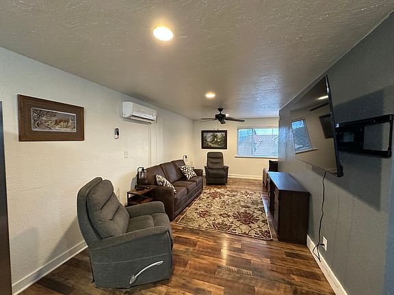 Living Room with Queen Sofa Sleeper and 2 Rocker Recliners.