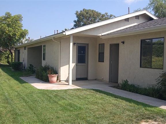 Backyard has separate door to garage and a backdoor entrace into kitchen