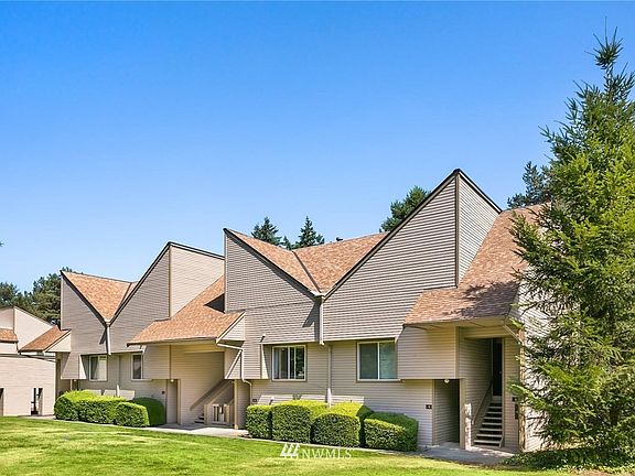 Photo of building and open area in front. 