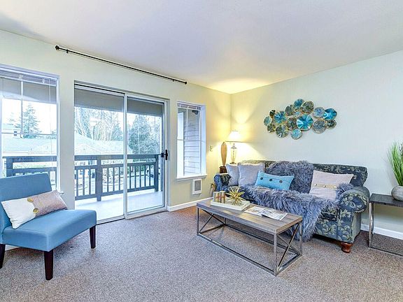 Living room, spacious and sunny all day.