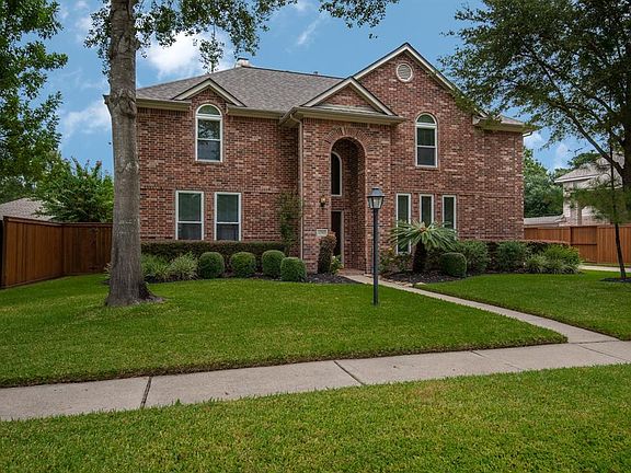 The home sits on a well manicured lot with shade trees and lush grass. The roof was replaced in 2014 and the fence in 2015.