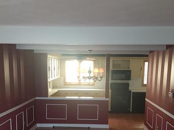 This room has been painted beige with white trim.