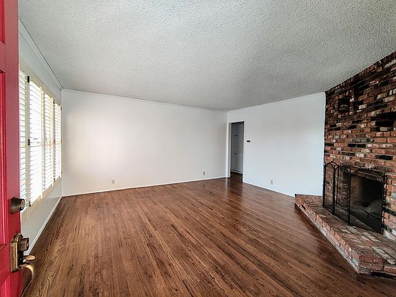 Living room with stately fireplace.