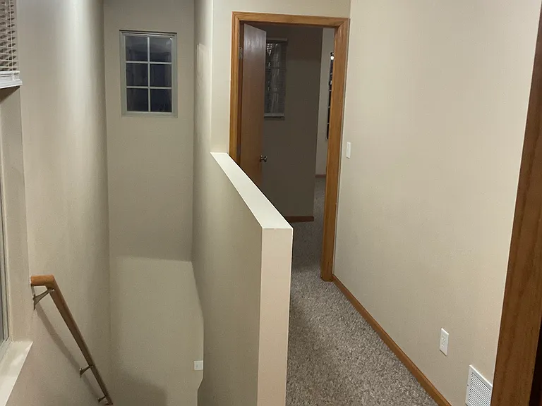 Carpeted stairwell from 2nd floor to the 1st floor