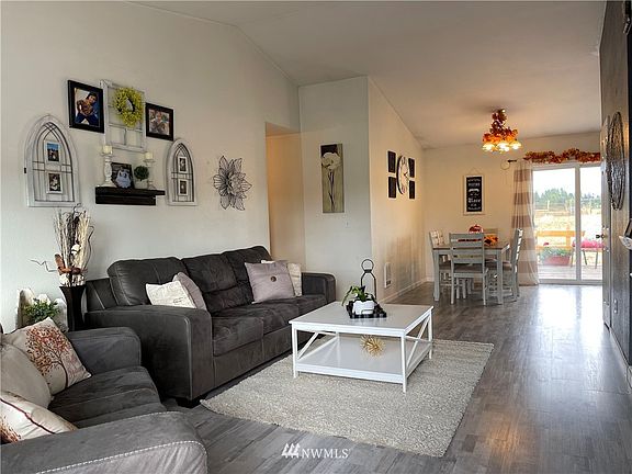 Swing open the door to find luxurious laminate hardwood throughout, vaulted ceilings, and open concept design.