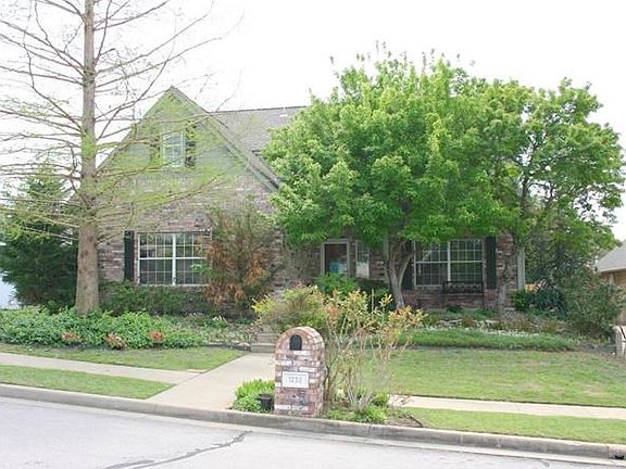 Home is located on a cul de sac with a view to a peaceful pond.