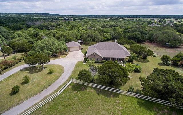 Beautiful 5 acres. This property has it all! 2500+ sq. ft. home, 4 car garage, 2000 +sq. ft. "shed",