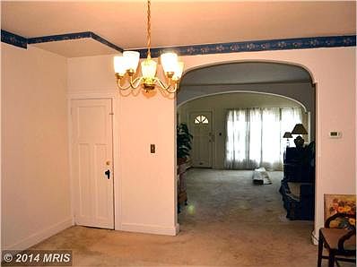 Dining Room with wood floors under carpet