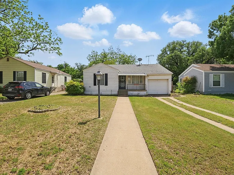 Single-story residence featuring a front porch with an awning, a one-car garage, and a concrete driveway