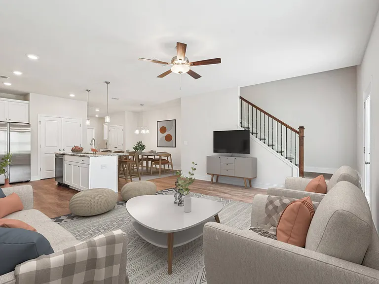 A refined living area offering a graceful view of the home's stairwell.