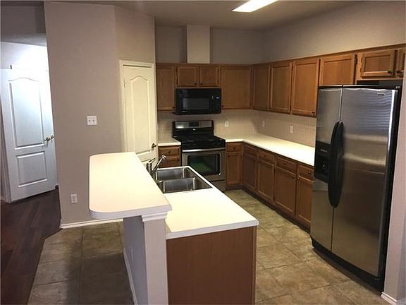 Island Kitchen with stainless steel appliances.