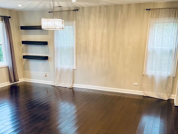 Open floor plan with living room, dining area and kitchen open.