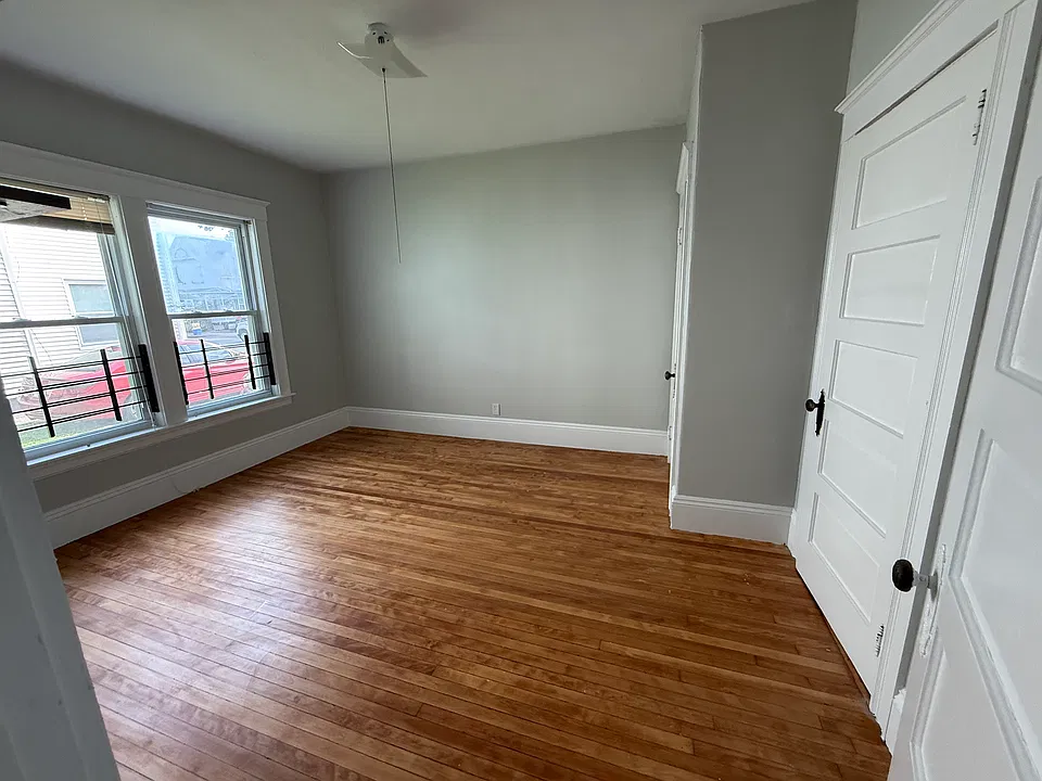 Bedroom with refinished hardwood floors