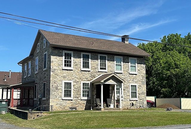 Stone home divided into 2 apartments. Left side is for rent. Has private parking and side entrance