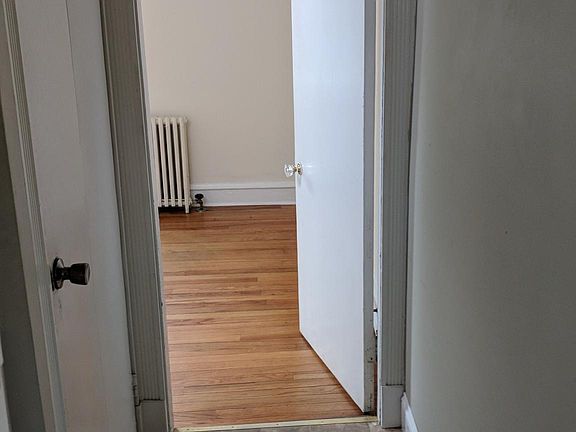 kitchen hallway leading into the downstairs bedroom