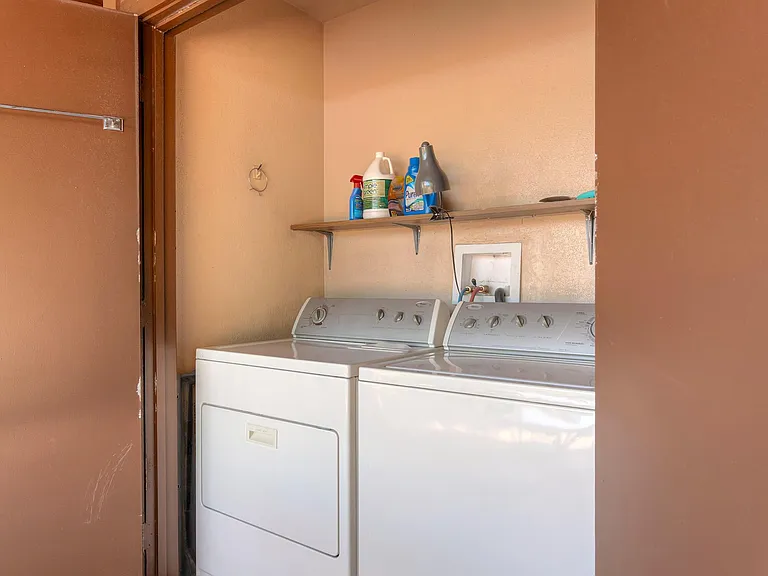 Washer and dryer off back patio.
