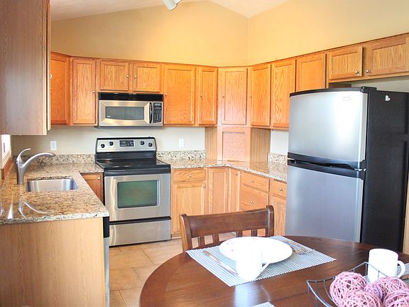 Renovated kitchen with stainless steel appls, ceramic tiles, granite counterto