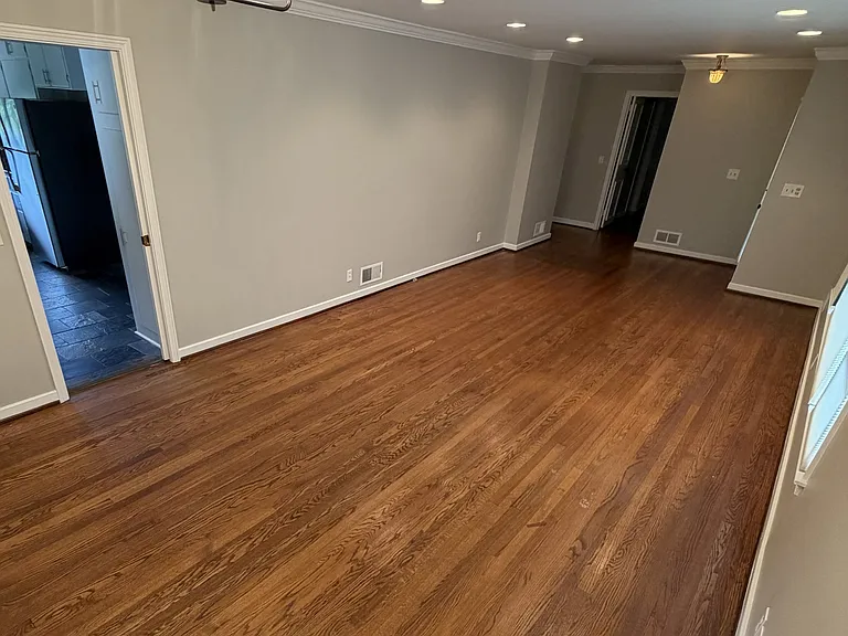 Very large dining room & living room area looking out to the front lawn & connected to kitchen