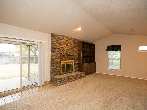 Sliding door offers access to covered outdoor living.