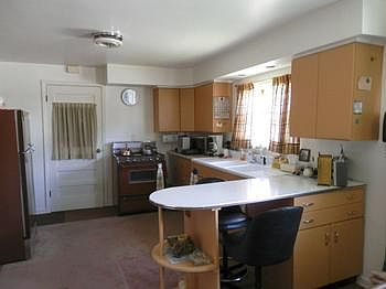 Kitchen with gas range & refrigerator