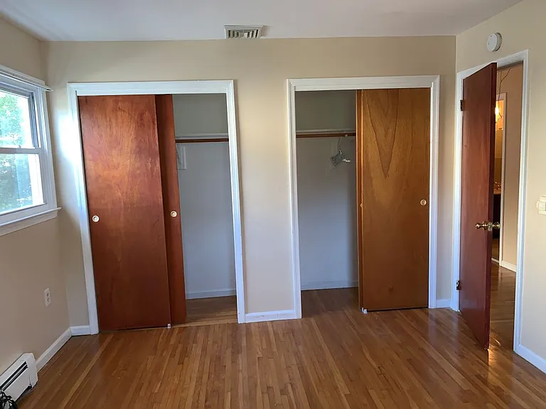 3rd Bedroom - Back photo looking at closets and entry door