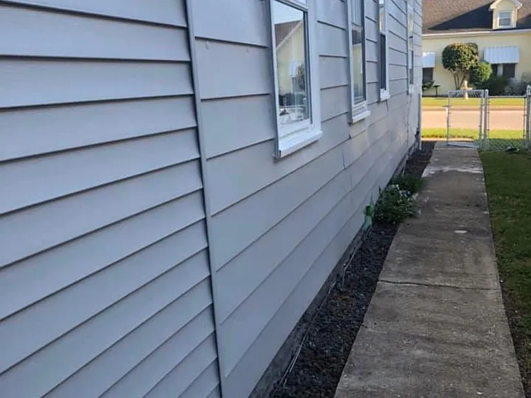 sidewalk that goes from front of house to back yard parking area.