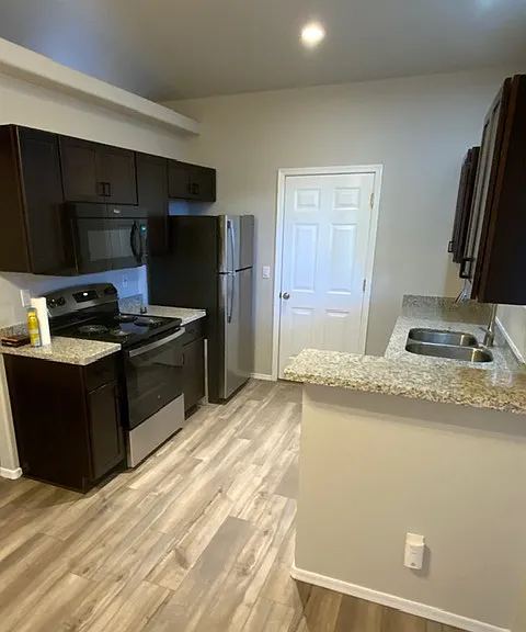 Picture of other unit. Flooring in unit for rent is plank shaped tile.