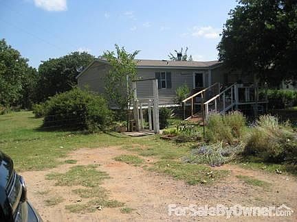 FRONT OF HOUSE- shade tree over porch