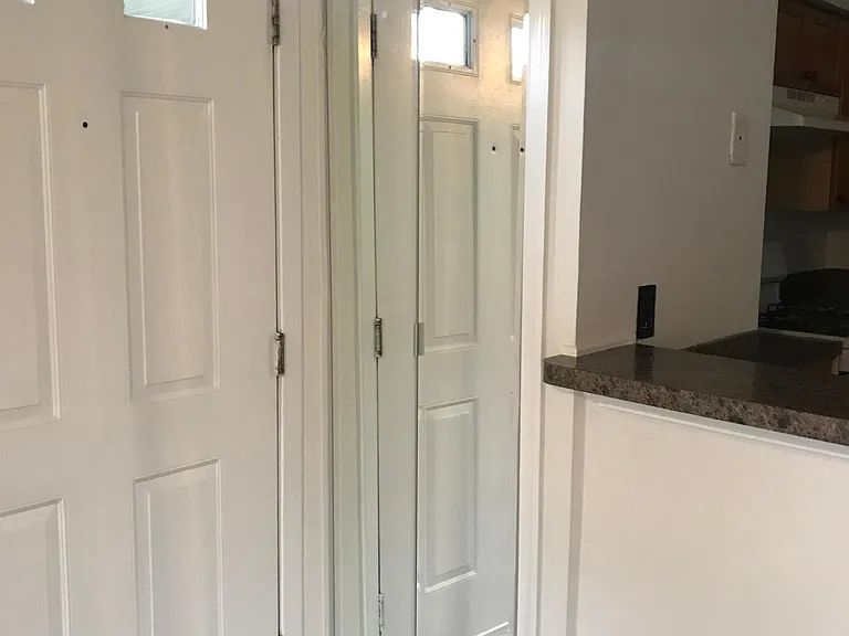 Coat Check with Mirrored Door