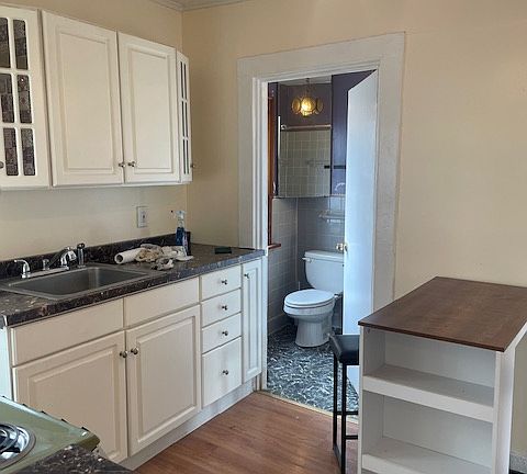 looking into full bath from kitchen