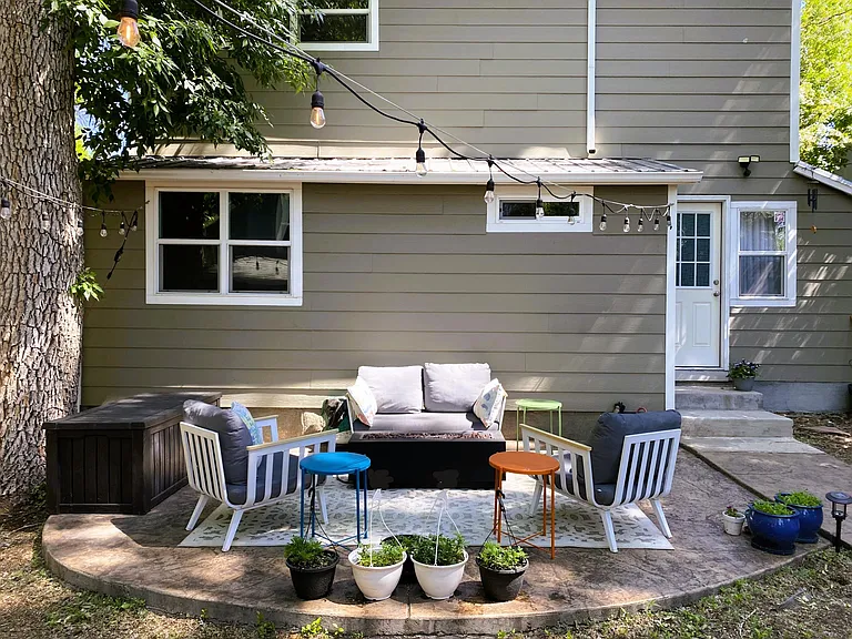 Professionally xeriscape landscaped backyard with 2 stamped concrete patios