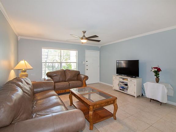 View from dining room area...very light and bright, travertine tile floor throughout...
