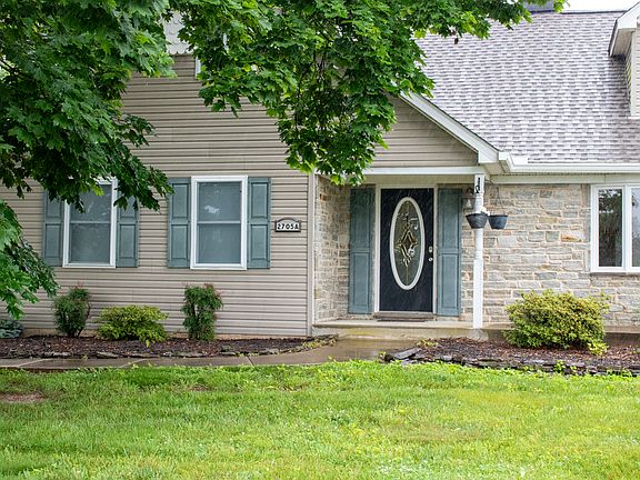 Front door with concrete porch