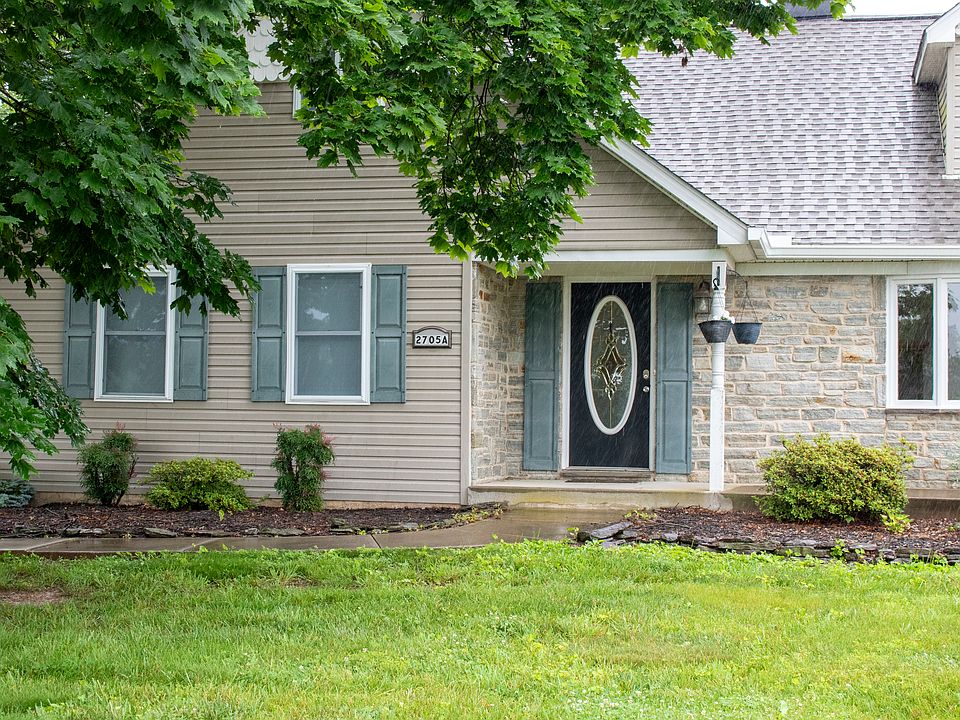 Front door with concrete porch