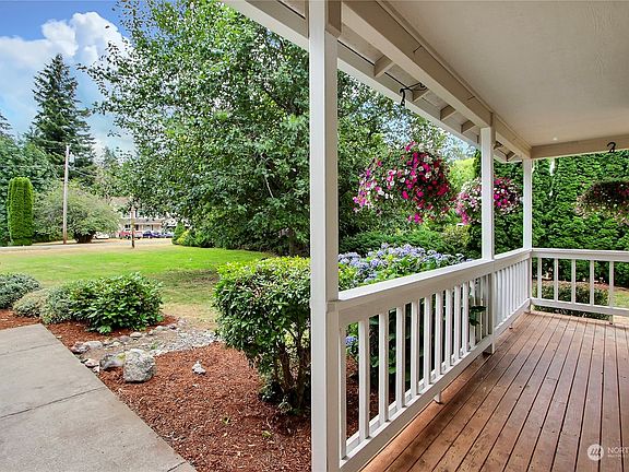 View of the front porch from the doorway, this wrap-around porch is amazing!>