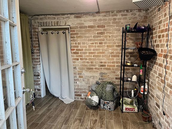Foyer/ storage area behind green curtain