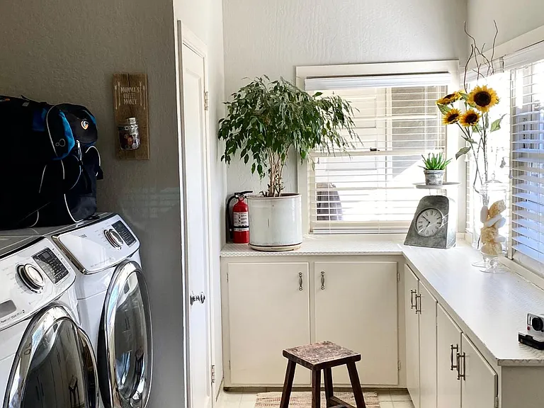 Laundry room next to kitchen