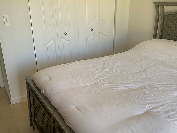 Bedroom 1 Queen Size with access to share balcony with roommate.