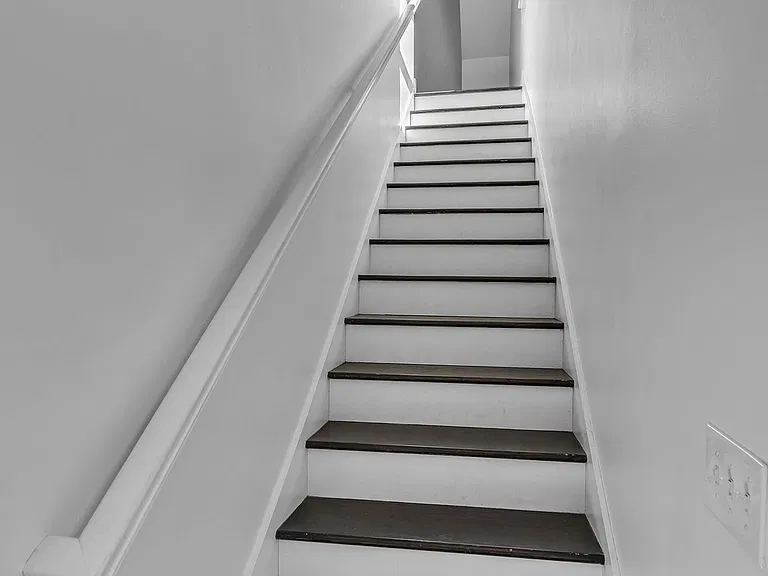 Stairs leading up to apartment from garage